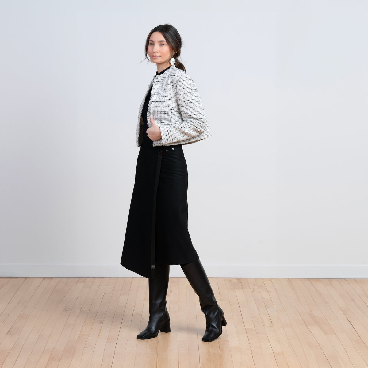 TUKUAN black wool mid-calf versatile overskirt styled for everyday wear, one size 0–4, designed and made in Quebec, Canada.